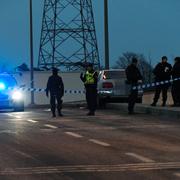 Polisens avspärrningar och tekniker efter skottlossningen den 1 februari.