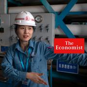 A worker gestures while standing near equipment for purifying and recycling wastewater at the Sinopec Yanshan Petrochemical Company on the outskirts of Beijing, Friday, May 25, 2018.