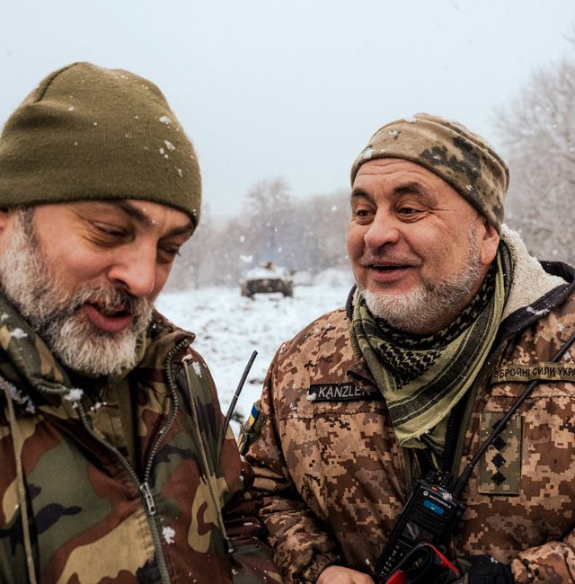 The tank commander Poltava, left, and his deputy, Chancellor, preparing to head toward the front line near Bakhmut, Ukraine on March 7, 2023. While both were trained in tank warfare, they left their military careers in the early 1990s, only to resume them in the current war. DANIEL BEREHULAK / NYT