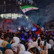Syrians celebrate after U.S. President Donald Trump announced plans during his visit to Saudi Arabia to ease sanctions on Syria and normalize relations with its new government, in Homs, Syria, May 13, 2025.