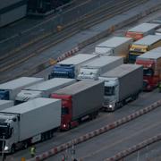 Lorries queue at a checkpoint to embark a ferry at the port in Dover.