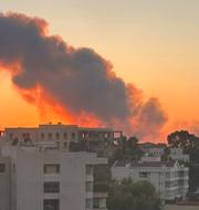 Rök stiger efter den israeliska attacken mot Beirut på fredagskvällen. 