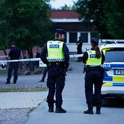 Polis på brottsplatsen.