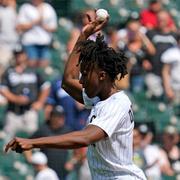 Chicago Bulls' Ayo Dosunmo throws out a ceremonial first pitch before a baseball game between the Chicago Cubs and the Chicago White Sox in Chicago, Sunday, Aug. 29, 2021.