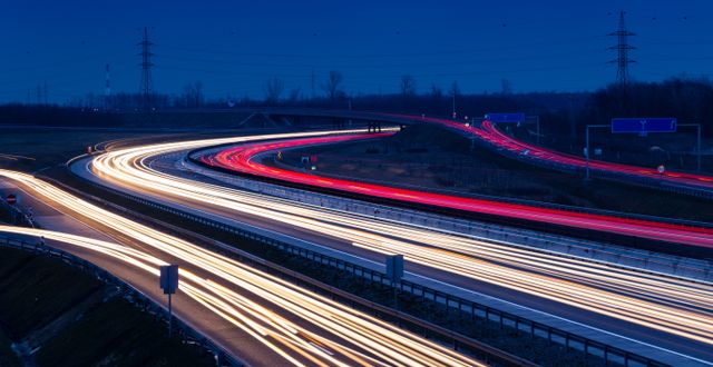Speed traffic light trails on motorway M0 to Budapest in Hungary.  Shutterstock