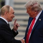 President Donald Trump greets Russia's President Vladimir Putin on the tarmac at Joint Base Elmendorf-Richardson in Anchorage, Alaska, Aug. 15, 2025. (AP Photo/Julia Demaree Nikhinson)  VOW106