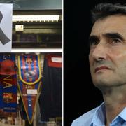 Ett sorgeband hänger över en kiosk som säljer FC Barcelona tröjor/Klubbens tränare Ernesto Valverde