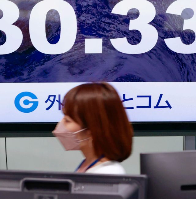 A financial monitor shows Japanese yen's exchange rate against the U.S. dollar at a currency dealing house in Tokyo on April 28, 2022. AP