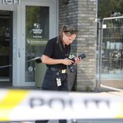 Polis på plats efter skjutningen.