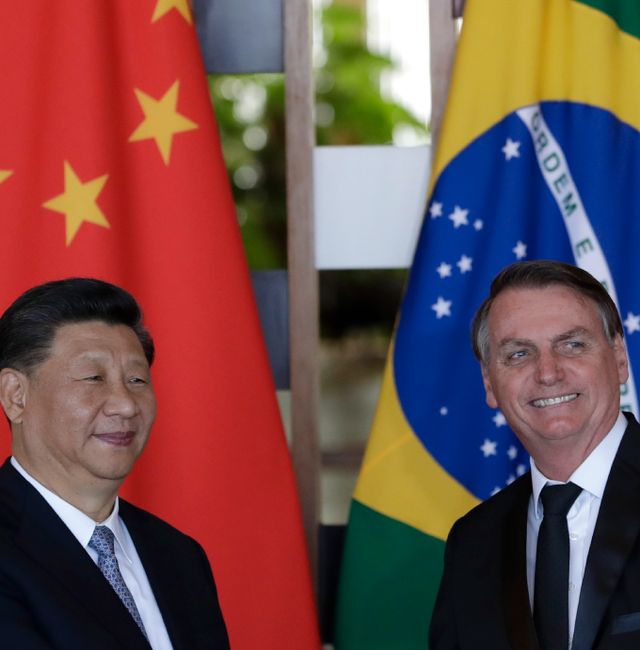 China's President Xi Jinping, left, and Brazil's President Jair Bolsonaro, smile after delivering their statements during a bilateral meeting on the sidelines of the 11th edition of the BRICS Summit, at the Itamaraty Palace, in Brasília, Brazil, Wednesday, Nov. 13, 2019. Eraldo Peres / AP
